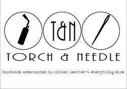 The image has a jeweller's torch and a needle to stitch with that implies these are the tools that are needed to make our products. We make sterling silver jewellery that needs a torch and genuine stitched leather that use a needle